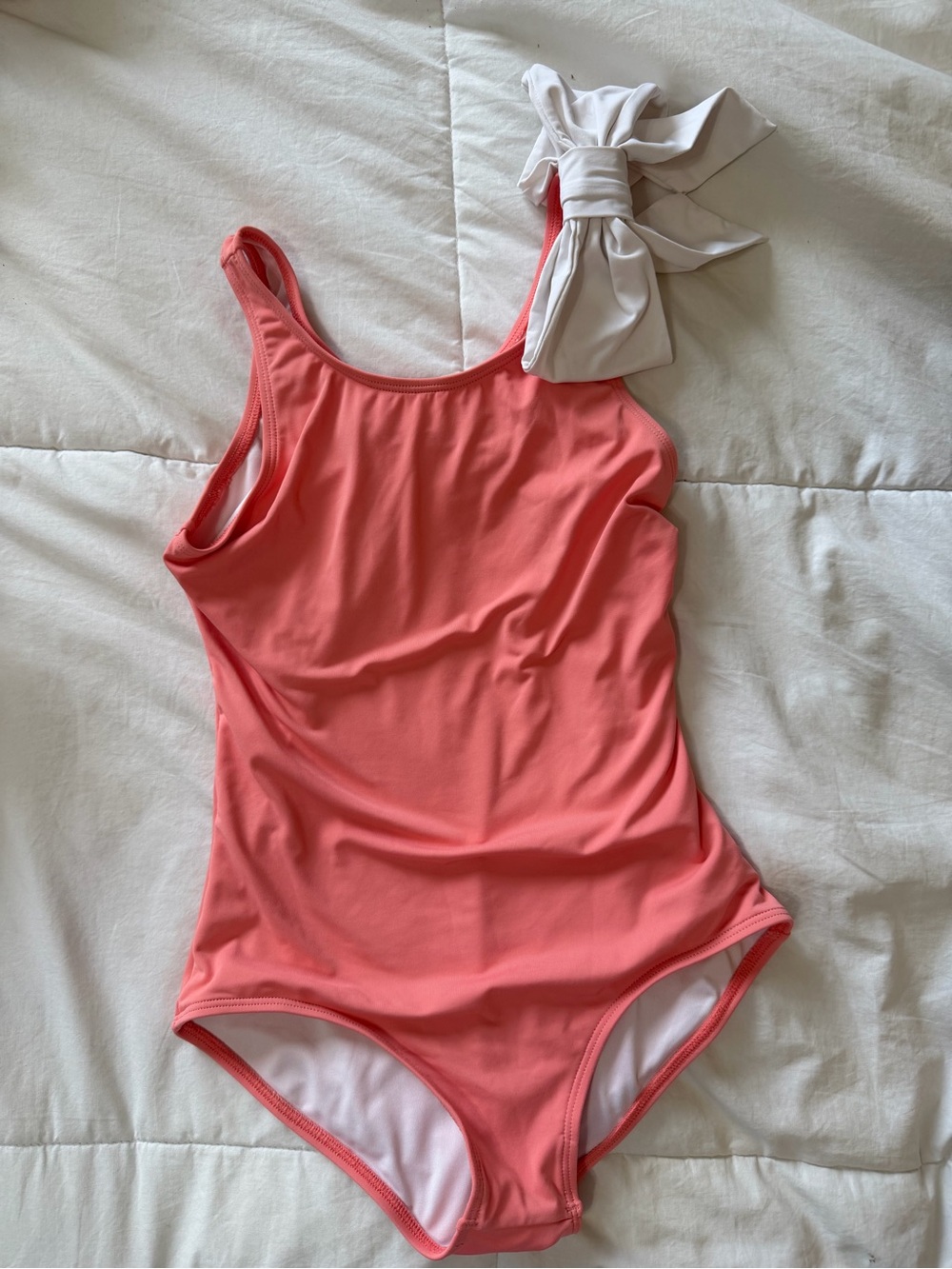 The Beaufort Bonnet Company Girls Coral One-Piece Swimsuit with Cream Bow